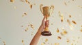 cropped shot of woman hand holdin golden cup.AI generative Royalty Free Stock Photo